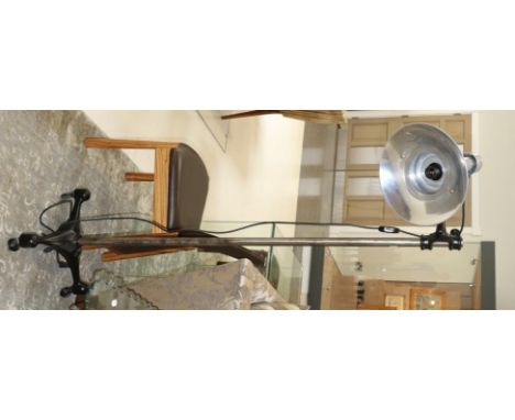 A Vintage Industrial Style Metal Pivoting Adjustable Spot Lamp, fitted for electricity, the polished shade mounted on a black