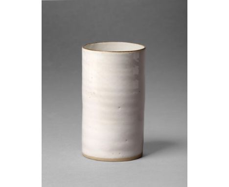 Dame Lucie Rie DBE (1902-1995): A Beaker Vase, stoneware with an all over oatmeal glaze and manganese rim, impressed Artist's