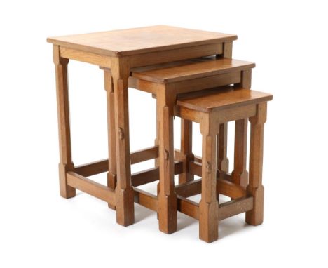 Mouseman: A Robert Thompson English Oak Nest-of-Tables, on four octagonal legs, each with carved mouse signature, largest 46c