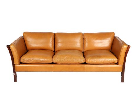 Stouby: A 1970s Three-Seater Orange Tan Leather Three-Seater Sofa, with mahogany effect frame, 200cm by 80cm by 66cm; and A M