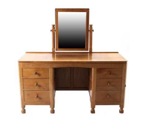 Mouseman: A Robert Thompson English Oak Dressing Table, with fixed central pivoting rectangular mirror and raised upstand, ab