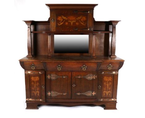 Robson &amp; Sons, Newcastle: An Arts and Crafts Oak Mirror Back Sideboard, the upper section with central inlaid cupboard do