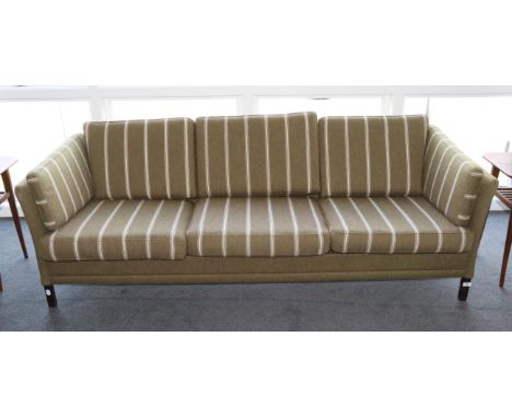 A Three-Seater Danish Design Sofa, in original stripped khaki fabric, with eight cushions and plain seat rail, on stained mah