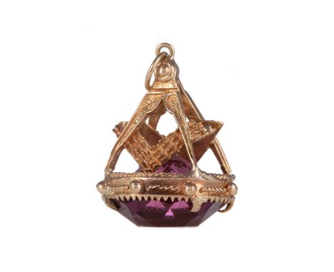 PURPLE GEM SET MASONIC FOB,set with a faceted purple gem, with square and compass finial, in nine carat gold, 8.8gCondition r