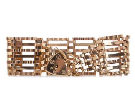 GATE BRACELET,24mm wide, with heart shaped padlock clasp, in nine carat gold, 14.6g