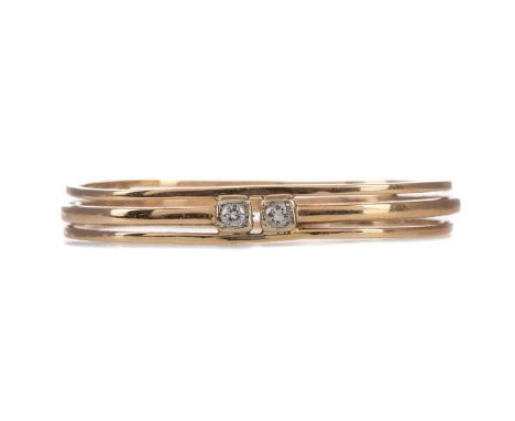 DIAMOND TWO STONE BANGLE,set with two round brilliant cut diamonds totalling approximately 0.40 carats, marked 14k, 27.1gCond