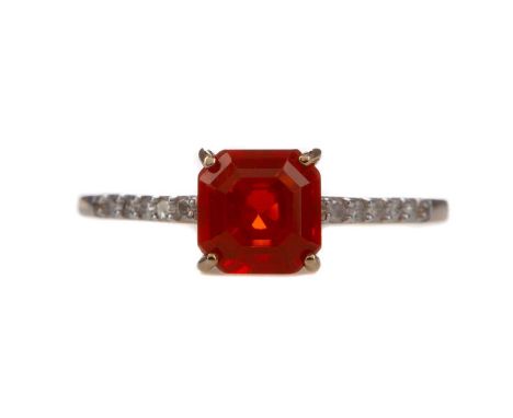 FIRE OPAL AND DIAMOND RING,set with a step cut fire opal, on diamond shoulders, faintly marked 9K, size P 1/2, 1.7g