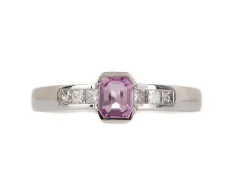 PINK SAPPHIRE AND DIAMOND RING,the step cut pink sapphire of approximately 0.66 carats flanked by princess cut diamonds total