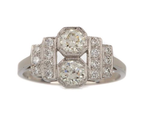 CERTIFICATED DIAMOND RING,set with two round brilliant cut diamonds totalling approximately 0.60 carats, on tiered diamond se