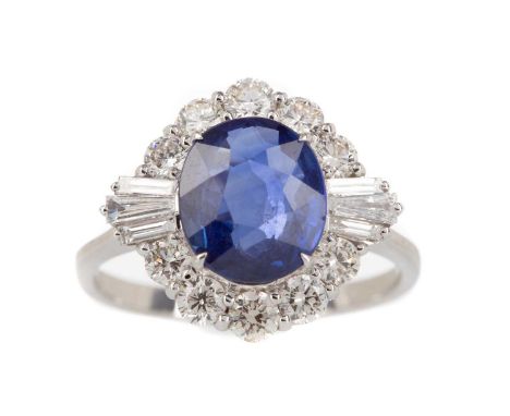 SAPPHIRE AND DIAMOND RING,the oval sapphire of approximately 2.79 carats, flanked by round brilliant and baguette cut diamond