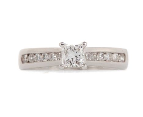 CERTIFICATED DIAMOND RING,the central princess cut diamond of approximately 0.40 carats, on round brilliant cut diamond shoul