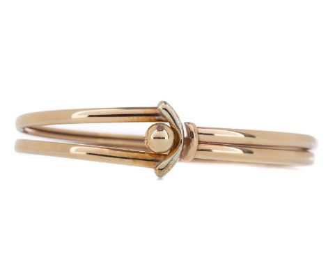 GOLD BANGLE,in nine carat gold, 9.8gCondition report: Generally worn.&nbsp;Fastens as it should.