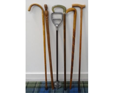 SELECTION OF WALKING STICKS
including an African stick with a carved figural handle, a shooting stick and many others (6) 