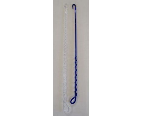 blue glass riding whip with whip spiralling around the cane and a clear glass riding whip with ring finial&nbsp;