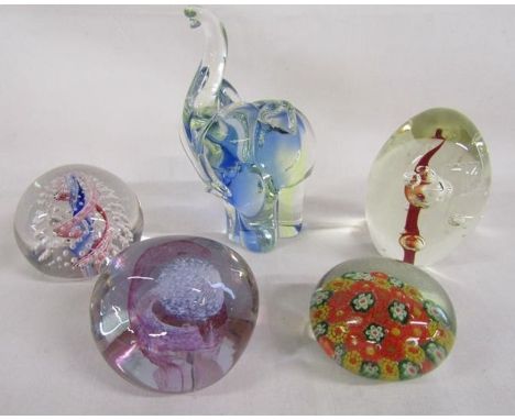 Collection of glass paperweights including Caithness 'pebble' and mosaic flower and an elephant