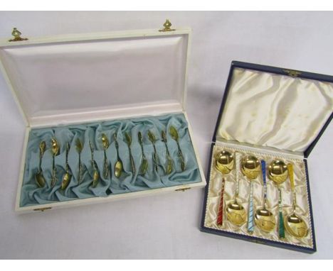 Cased set of 12 gilded Copenhagen 1939 silver spoons with flowers and leaf design and cased set of Denmark silver enamelled s