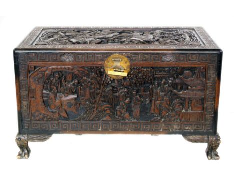 First half 20th century carved Chinese camphor chest, top decorated with duelling warriors on horseback, front panel carved w
