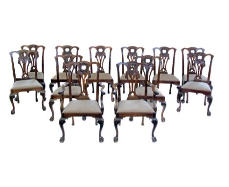 Set of twelve mid 19th century mahogany dining chairs, comprising ten singles and two open arm carvers, all of Irish Chippend
