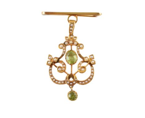 Edwardian 9ct gold peridot and seed pearl pendant brooch , central oval peridot measuring approx. 7mm x 5mm, fine gold frame 