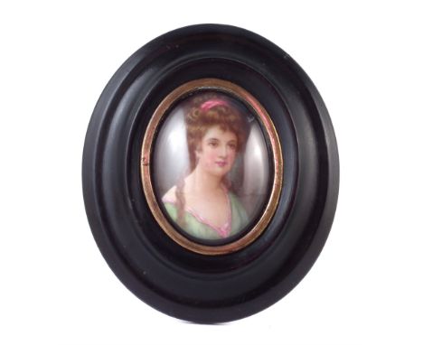 Leslie Johnson oval miniature on porcelain plaque , painted with a portrait of a lady, 6cm high, the frame measures 12cm. For
