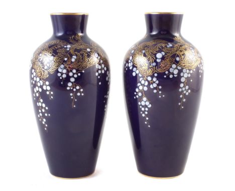 Pair of Sevres vases signed R. Jeandot, decorated with white blossom and gilt leaves on a navy ground, 1920 / 1921 back stamp