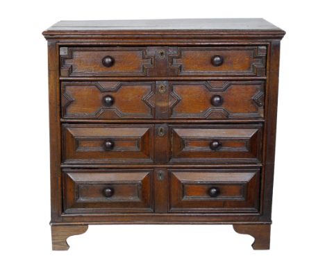 Early 18th century Jacobean design chest of four graduated drawers, rectangular top with moulded edge, each drawer with later