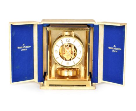 A Jaeger LeCoultre Atmos clock in presentation case and with brushed aluminium bracket (custom made for this clock). The bras