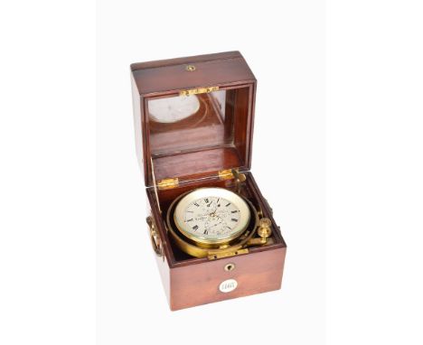 An early 19th century marine chronometer by Brockbank & Atkins, London, No. 1167. The three tiered mahogany case with brass c