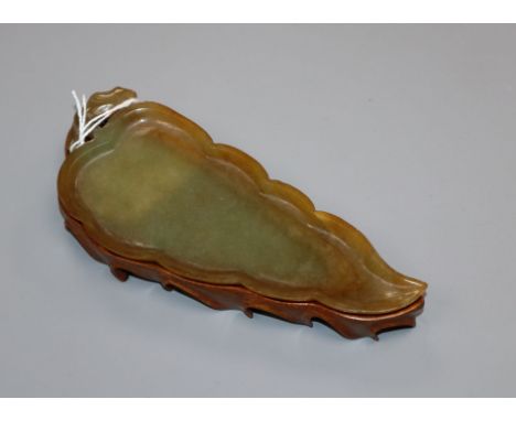 A Chinese jade leaf on stand