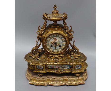 A gilt metal and porcelain mantel clock height 37cm