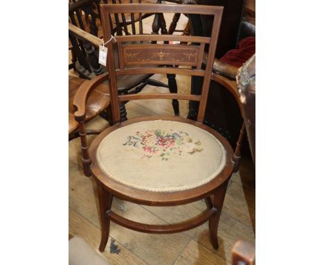 An Edwardian tapestry seat elbow chair