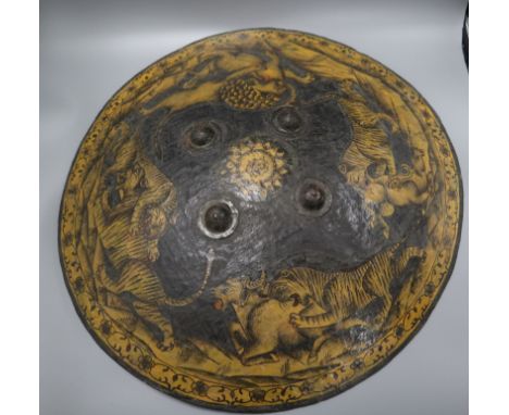 An Indian papier mache shield, depicting hunting tigers and a lion diameter 55cm