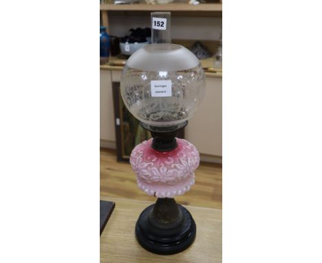 An oil lamp and shade height 59cm