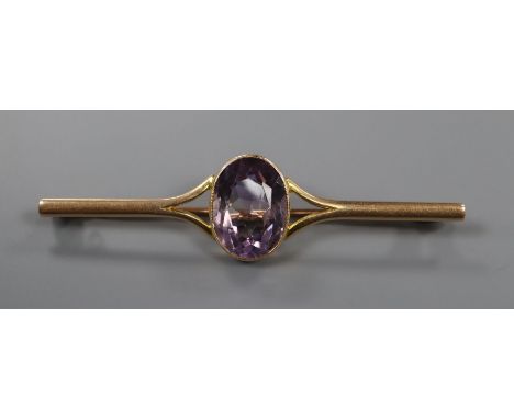 A 15ct and amethyst set bar brooch, 63mm.