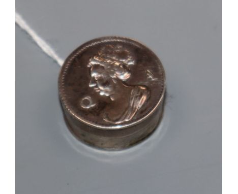 A small circular white metal patch box and cover with profile portrait of Queen Anne, makers mark 'TK', Dia 2.5cm