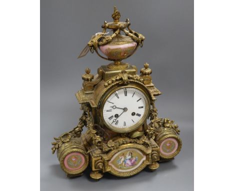 A 19th century Louis XVI style ormolu mantel clock inset with porcelain panels height 38cm