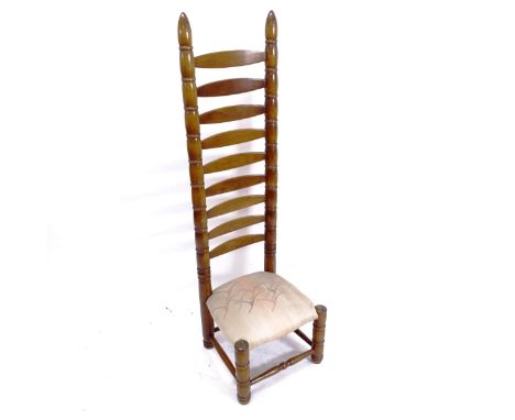 A mid-century tall ladder-back chair, in the manner of Charles Dudouyt 