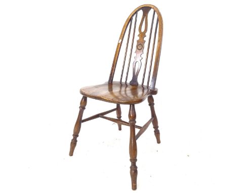 An elm-seated Windsor stick-back chair, impressed W.W to the back of the seat 