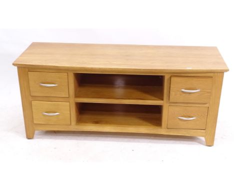 A modern light oak television stand, with open shelves and 4 short drawers, L120cm, H51cm, D45cm 