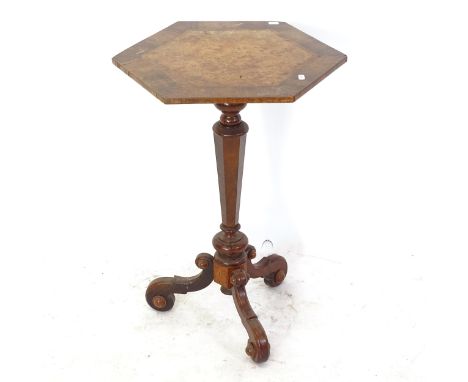 A 19th century crossbanded walnut lamp table on tripod base, W44cm, H71cm 