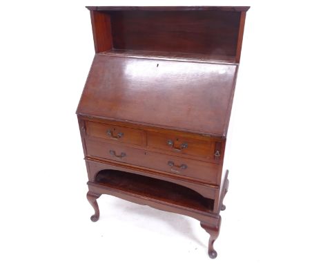 An Edwardian mahogany bureau, with shaped raised shelf, 3 long drawers and open shelf below, on cabriole legs, W75cm, H119cm,