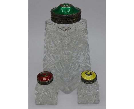 A silver and enamel shaker and a salt and pepper, with green, red and yellow tops, marked Sterling 925S Norway, by Hroar Pryd