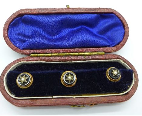 A set of three yellow metal, onyx and seed pearl studs