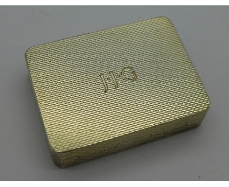 A silver snuff box or pill box, engine turned, with gilt interior, Birmingham 1972, 44g, with initials