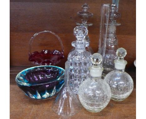 Two pairs of decanters, one other decanter, a glass funnel, a glass vase, a coloured glass dish and a ruby glass basket