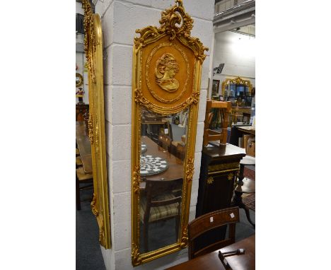 A GOOD PAIR OF GILTWOOD LONG NARROW MIRRORS with a large circular portrait. 6ft high x 1ft 6ins wide.