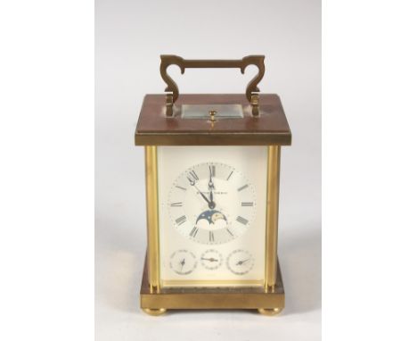 A MATTHEW NORMAN FOUR DIAL BRASS CARRIAGE CLOCK, dated 1981. 5ins high, in a folding leather case.