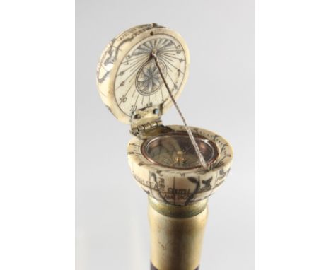 A WALKING STICK with carved bone globe.