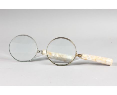 A PAIR OF MAGNIFYING GLASSES with mother-of-pearl handles.