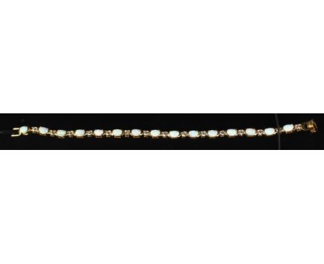 A SILVER 18CT GOLD PLATED OPAL LINE BRACELET.